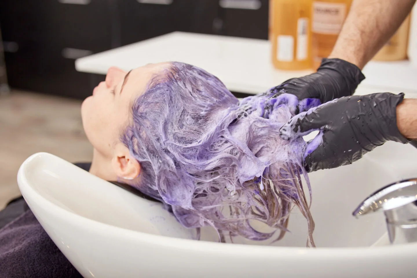 Which hair colors does purple shampoo help with?