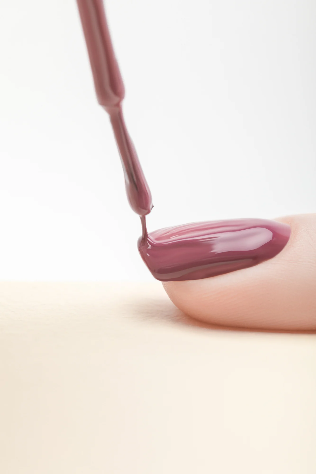Can you paint over gel nails with a regular nail polish?