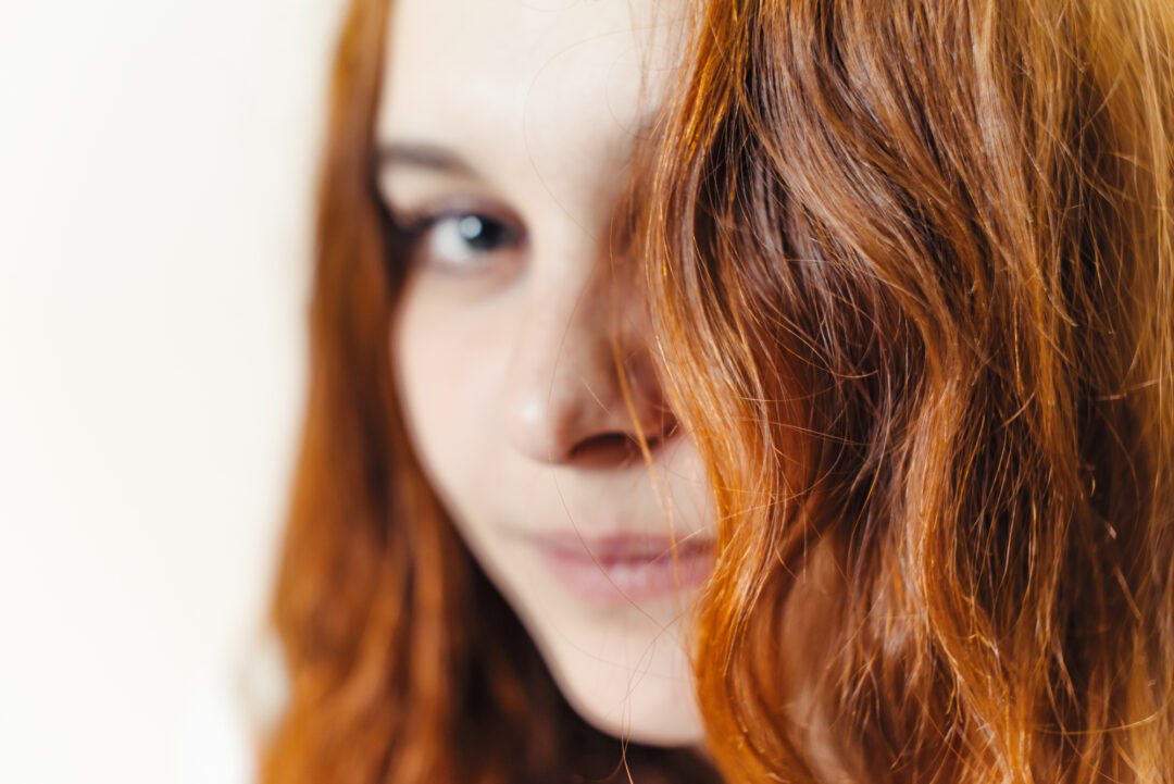 Why Is My Hair Turning Red? [Natural Hair Changing Colors?]