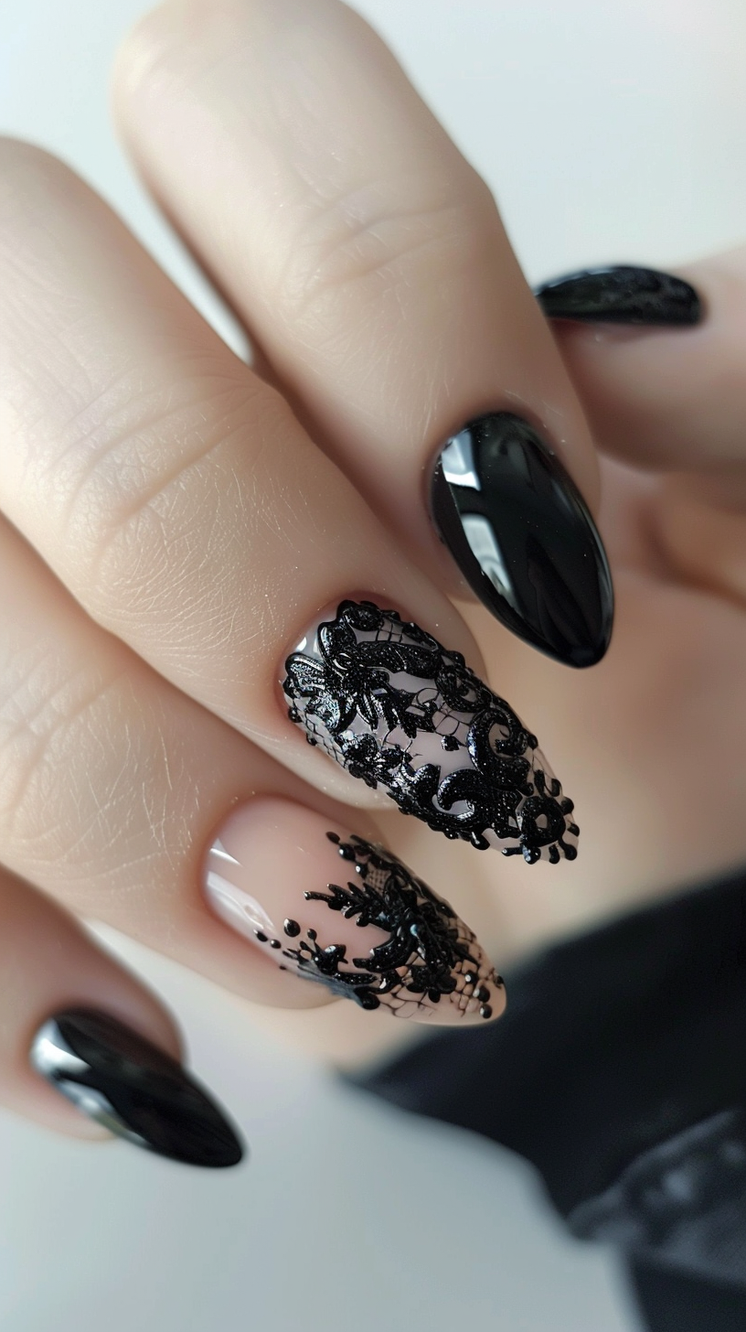 Almond-shaped nails feature a glossy black polish paired with intricate black lace designs over a nude base. The lace patterns, adorned with floral motifs, add a touch of elegance and sophistication. The contrast between the glossy black and the delicate lace creates a striking and stylish look.