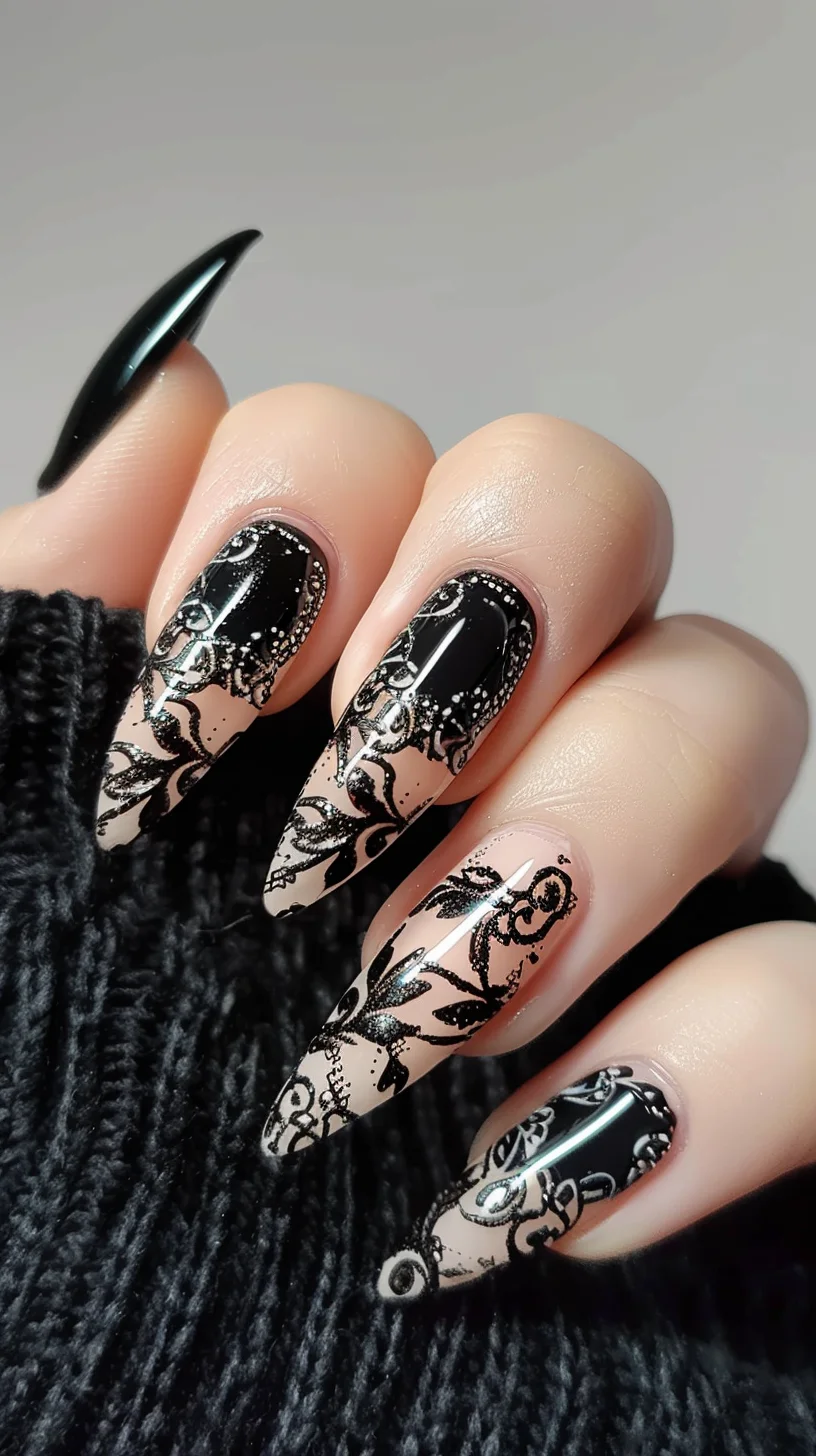 A nude base sets off detailed black lace designs that cover most of the nails, creating a striking contrast. The lace includes intricate floral and geometric patterns, while the stiletto shape of the nails enhances the dramatic and stylish effect.