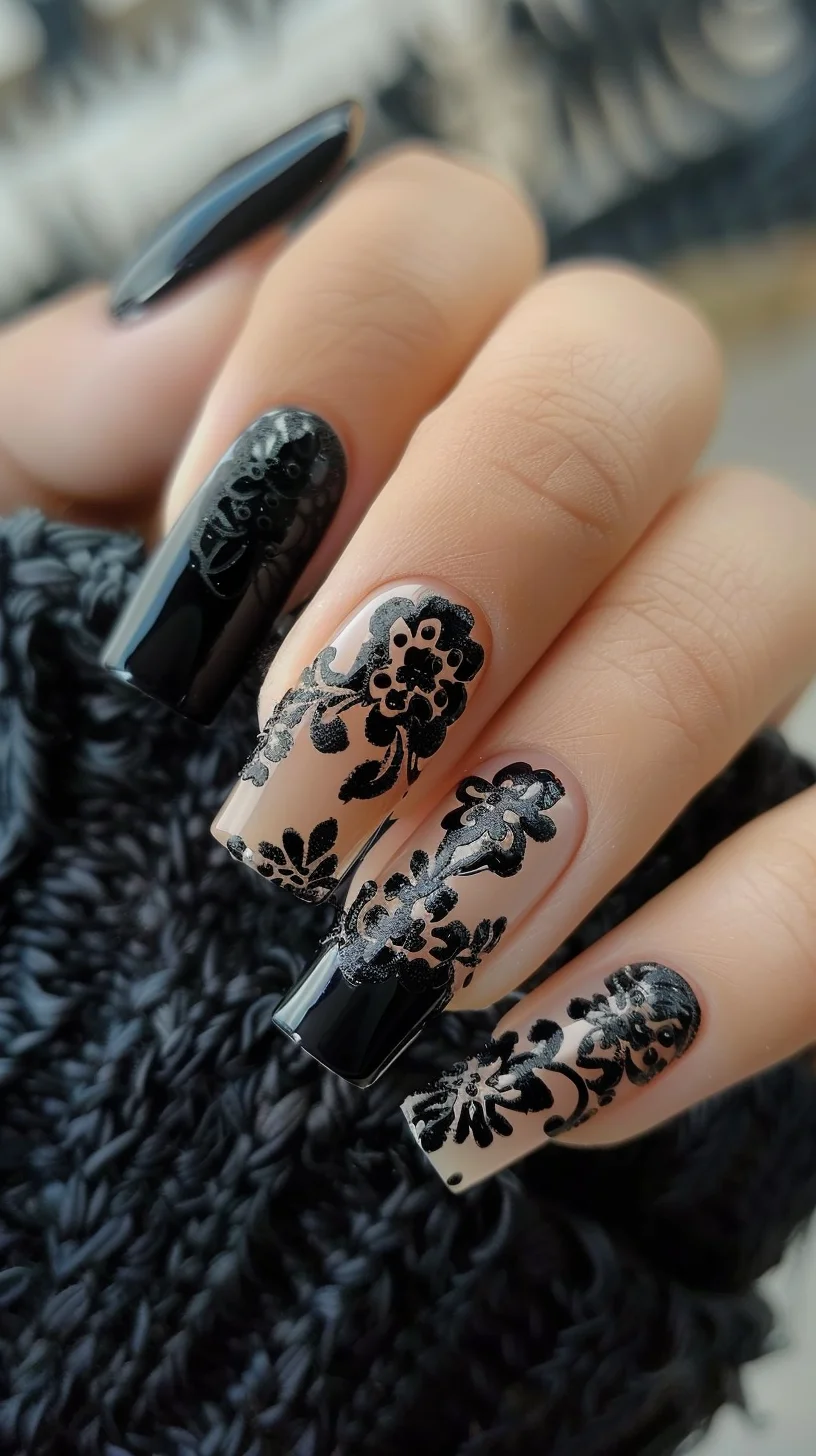 Long, almond-shaped nails combine glossy black polish with black lace designs over a nude base. The lace features floral and vine patterns, creating a delicate and sophisticated appearance. The combination of black and nude provides a striking contrast.
