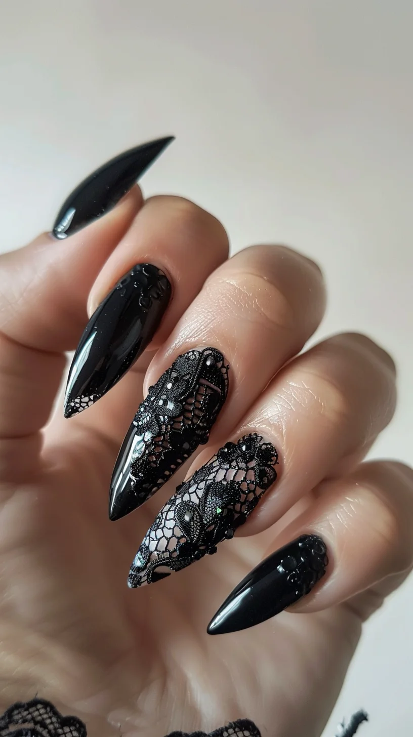 Glossy black nails are complemented by detailed black lace designs over a nude base. The lace features floral motifs and is adorned with small black beads, adding texture and sophistication. The nails are stiletto-shaped, enhancing the dramatic look.
