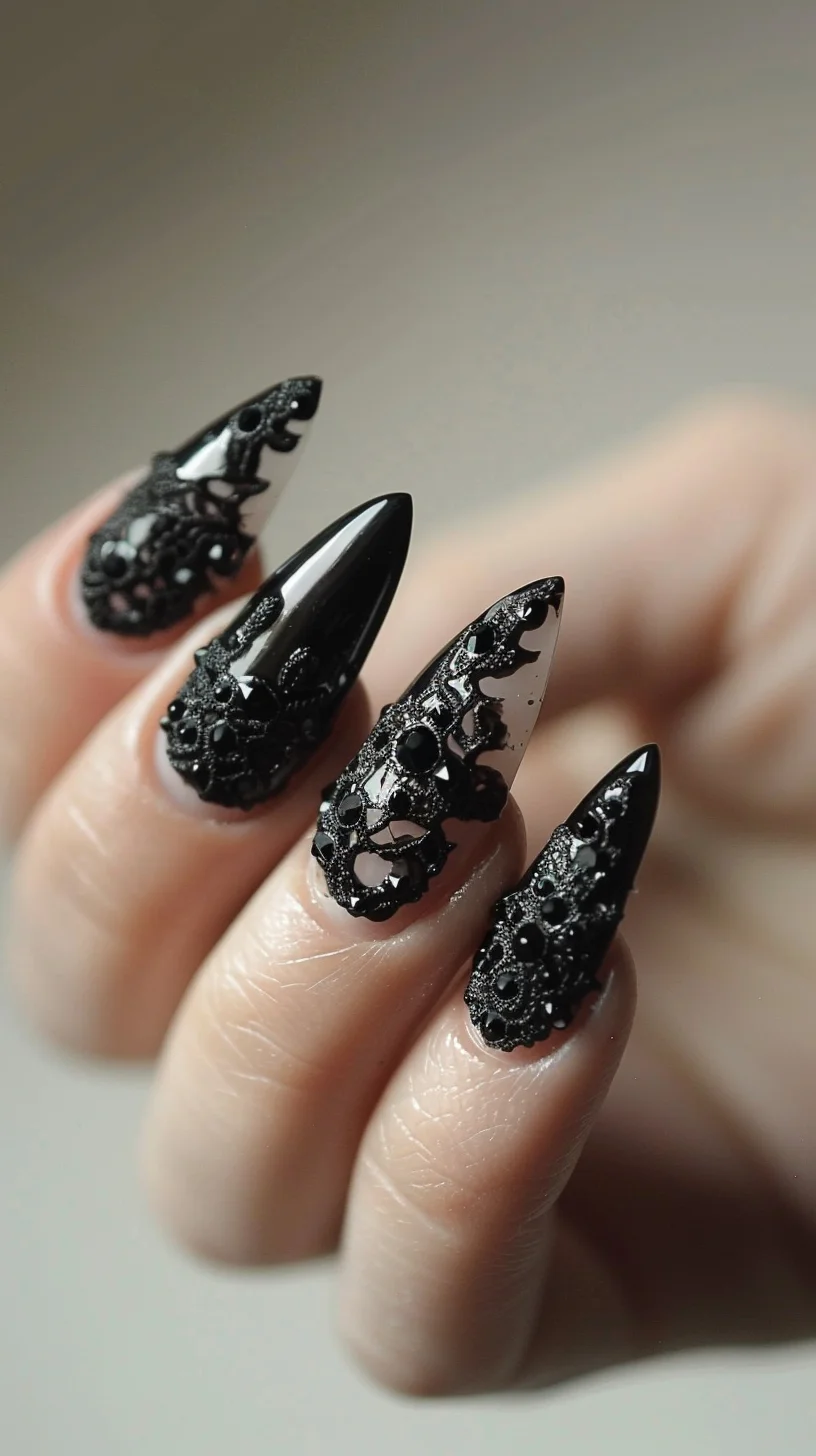 Glossy black stiletto nails are adorned with detailed black lace designs, accented with small black beads for added texture. The lace patterns feature floral and geometric elements, creating a luxurious and dramatic appearance.