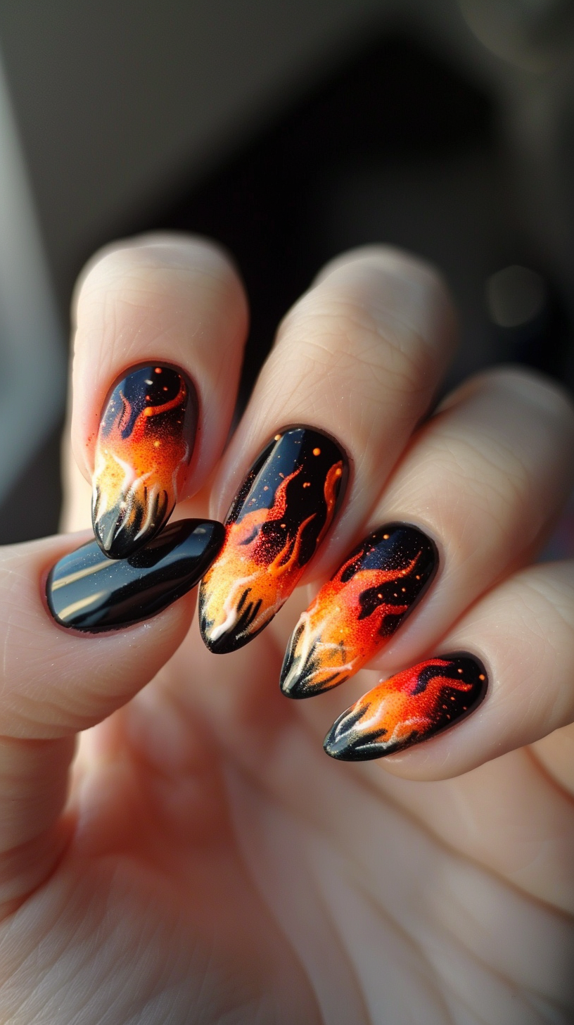 A seamless gradient from deep black to fiery orange and yellow flames defines these nails. The flames appear to glow, creating an intense and dynamic look, ideal for those who want their nails to stand out.
