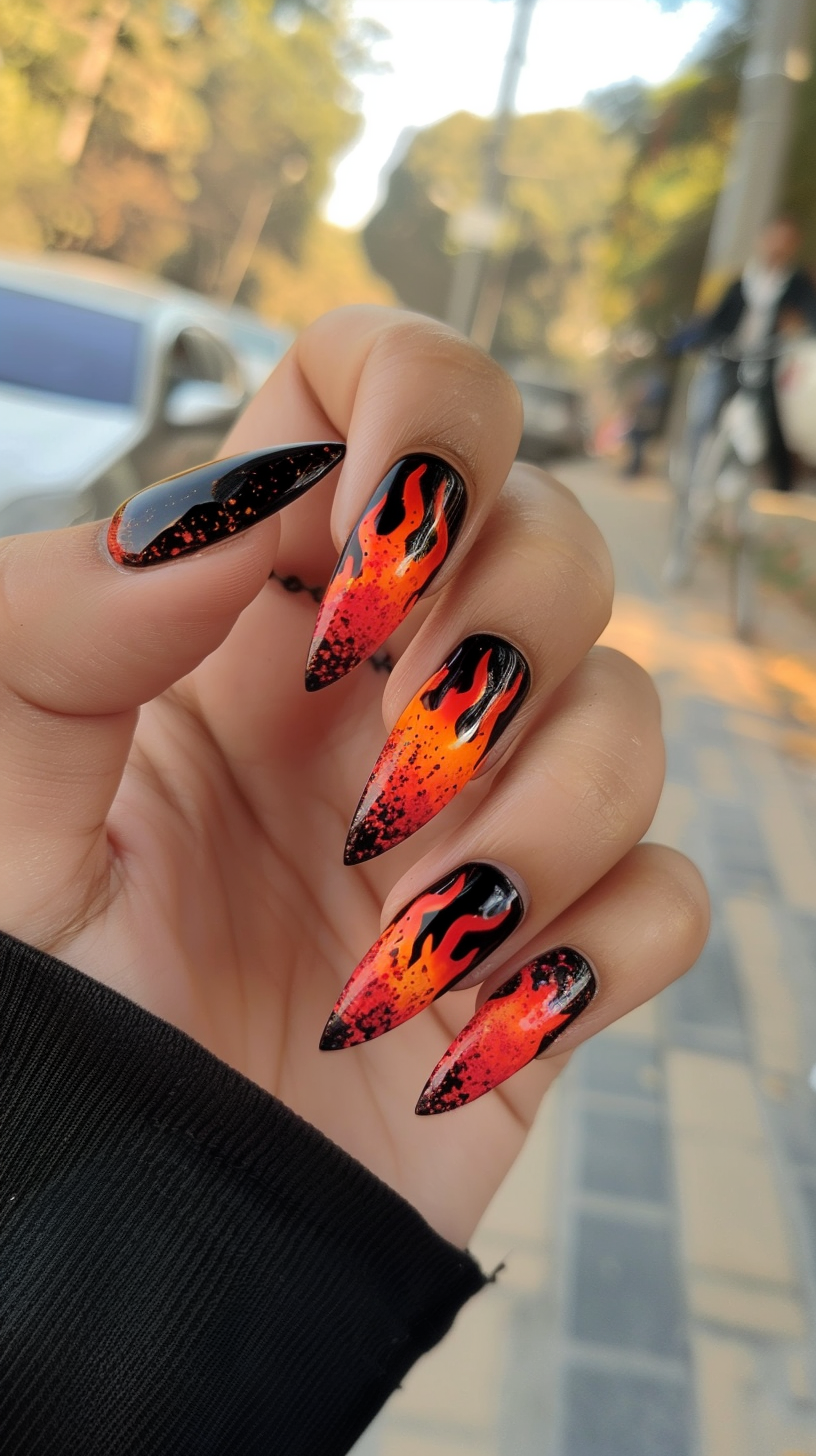 This design features a dramatic transition from a dark base to bright, fiery tips. The intricate flame details and vibrant colors make these nails a standout choice for those looking to add some heat to their style.