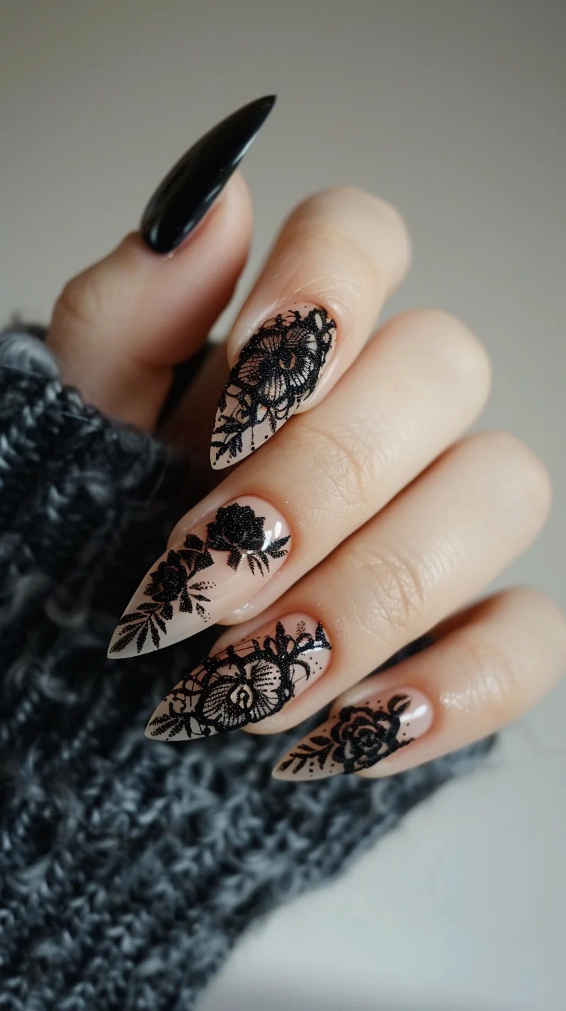 Long, pointed nails with a nude base are adorned with detailed black lace designs. The lace features floral and geometric patterns, creating a sophisticated and intricate look. The black lace contrasts sharply against the nude background, enhancing the design's elegance.
