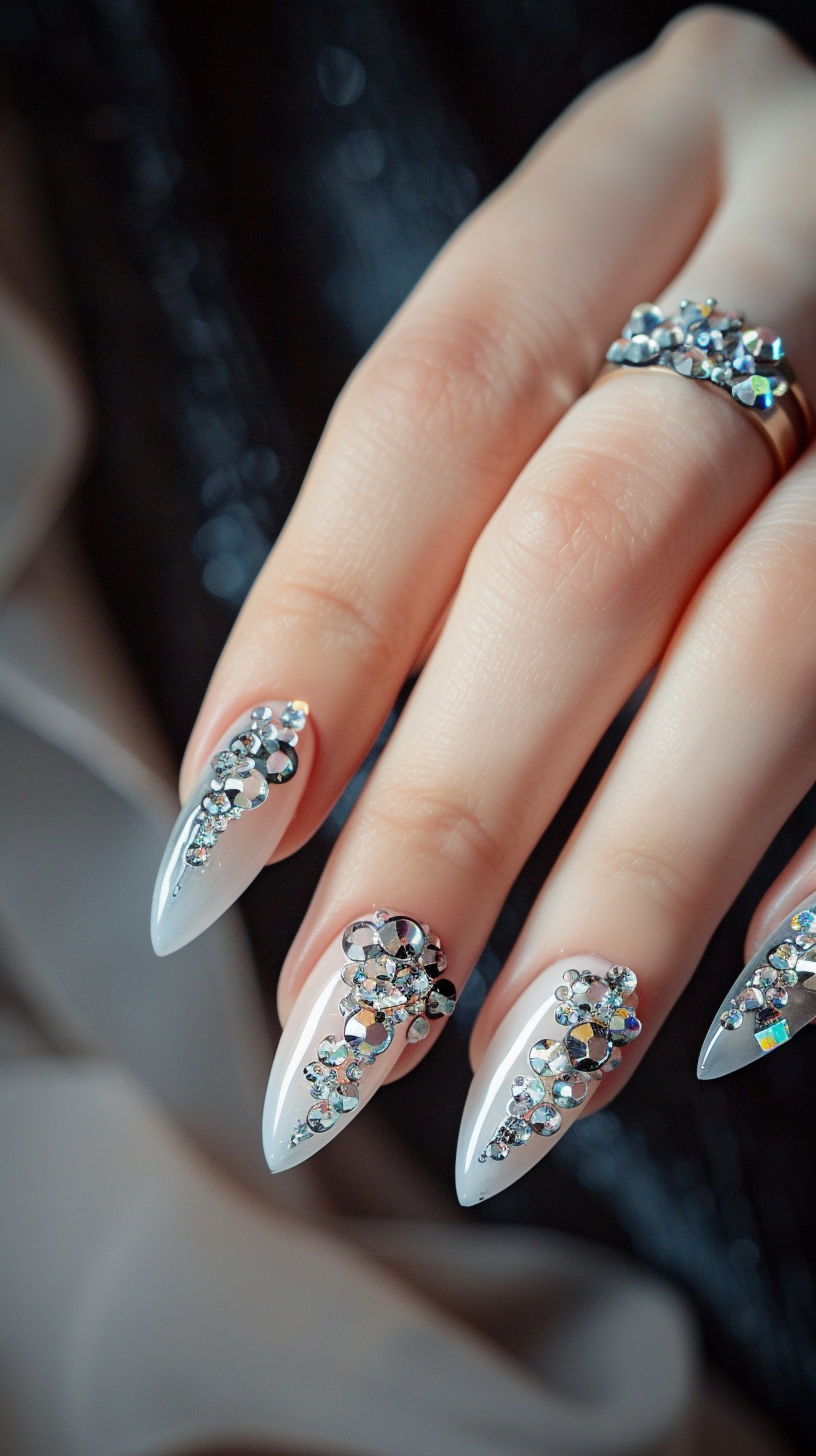 These elegant nails are decorated with a variety of crystals, creating a luxurious and intricate design. The combination of different sizes and shapes of crystals on a nude base adds a touch of glamour and sophistication. This design is perfect for special occasions or when you want to add a bit of sparkle to your everyday look.