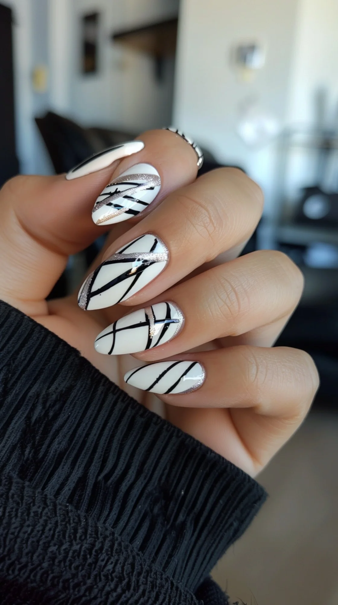 A modern take on the classic black and white combo, this design features thin, crisscrossing lines over a white base. The addition of glitter accents elevates the look, making it perfect for any occasion.