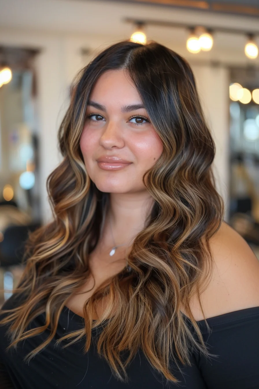 Thick, luscious waves are styled to perfection with a soft center part that frames the face beautifully. The blend of deep brown tones with lighter, sun-kissed strands creates a radiant glow, making this look both glamorous and easy-going, ideal for any occasion.